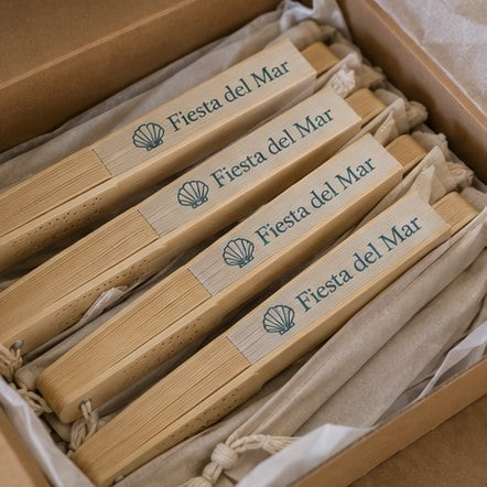 Custom bamboo fans in bulk boxed for an event