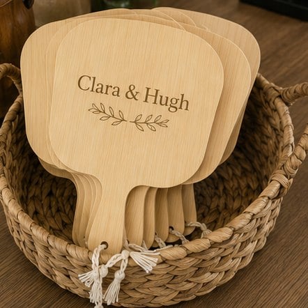 Personalized wedding hand fans in a basket