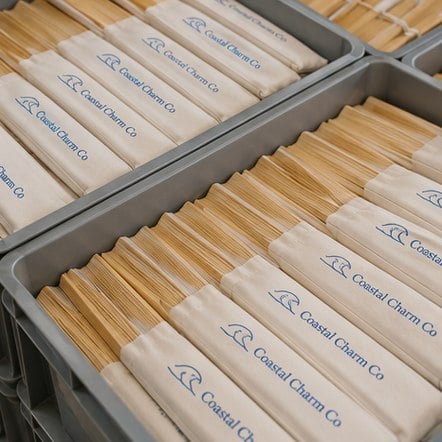 Wholesale printed bamboo fans stacked in trays